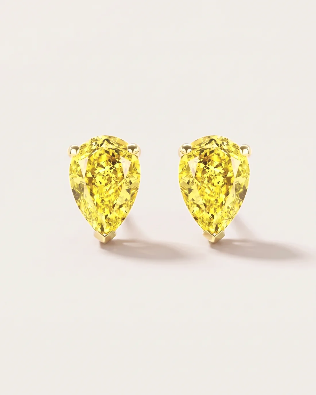 ORTIGAS Yellow Pear Studs, серьги, вид спереди